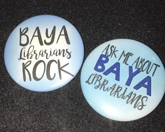 Bay Area Teen Librarians buttons. Two buttons. One button says "BAYA Librarians ROCK" and the other says "Ask Me About BAYA Librarians"